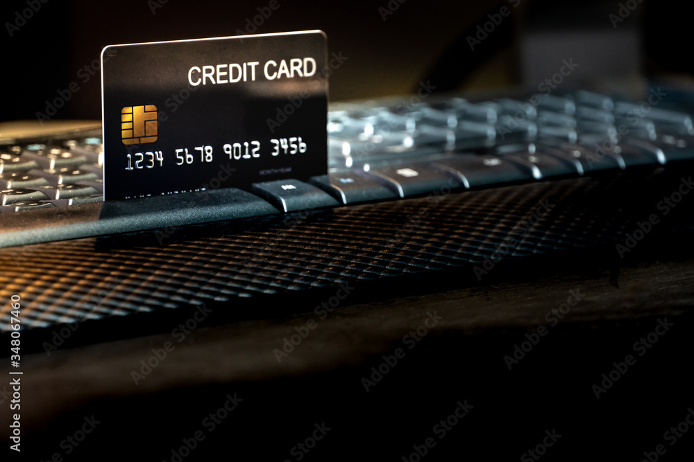 Poster Shallow focus Credit Card on Computer keyboard. Background for E-commerce and online shopping concept.