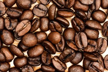 Roasted coffee beans close up background 