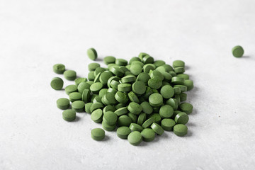 Green chlorella pills. Concept of superfood and detox. 