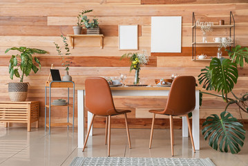 Interior of modern stylish dining room with floral decor