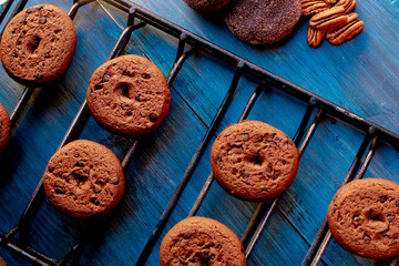 Baked chocolate chip cookies on an artistic background.