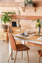 Interior of modern stylish dining room with floral decor