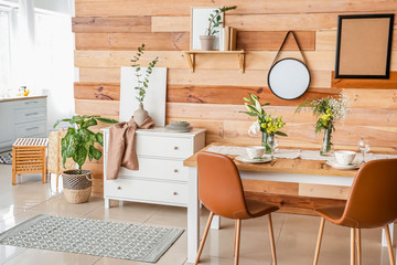 Interior of modern stylish dining room with floral decor