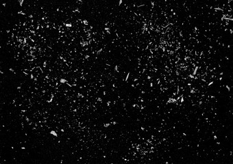 Dust background. Grunge photo editor layer. White flakes on black copy space.