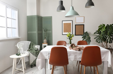 Interior of modern stylish dining room with floral decor