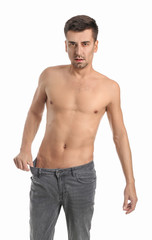 Fototapeta premium Young man with anorexia on white background