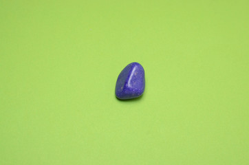 Pebbles on green background