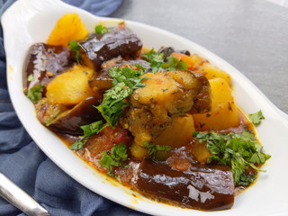Top down view of a plate of Gluten free and vegan Eggplant and Potato curry or fry