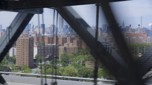 The view of Manhattan from a subway train approaching the city on the Williamsburg bridge