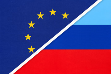 European Union or EU vs Luhansk Republic national flag from textile. Symbol of the Council of Europe association.