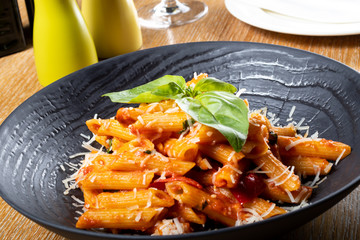Pasta penne Napoli, traditional italian. Penne al'arrabiata (pasta with a spicy tomato sauce)