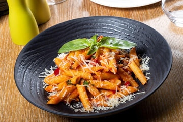 Pasta penne Napoli, traditional italian. Penne al'arrabiata (pasta with a spicy tomato sauce)