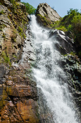 Rocky mountains waterfall in the afternoon short exposure flash