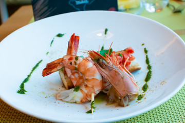 Shrimp, bruschetta with tomatoes, garlic and fresh basil