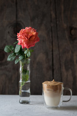 Whipped iced coffee latte on a wooden background