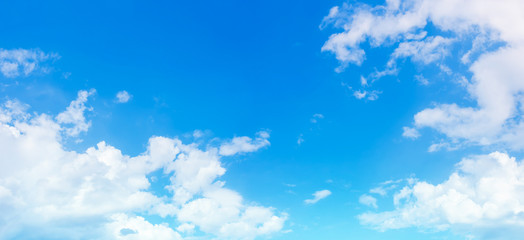 Bright clouds in light blue sky