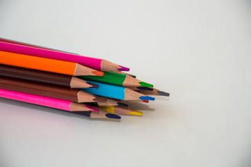 coloured pencils on white background