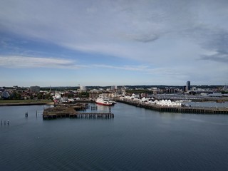 Fototapeta na wymiar Southampton, UK - May 05, 2020: view on the cargo and cruise ship port buildings infrastructure from the cruise ship