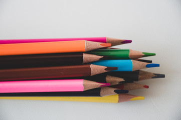 colored pencils on white background