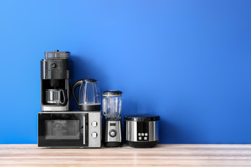 Different household appliances on table
