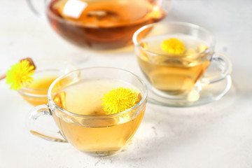 Healthy dandelion tea with honey on table