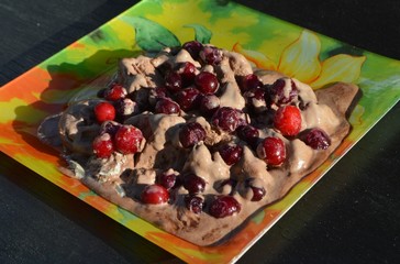 
delicious ice cream with cherry berries lies on the table