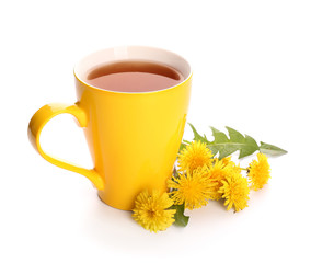 Cup of healthy dandelion tea on white background