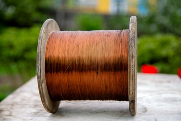 wooden cable reel with wound copper wire