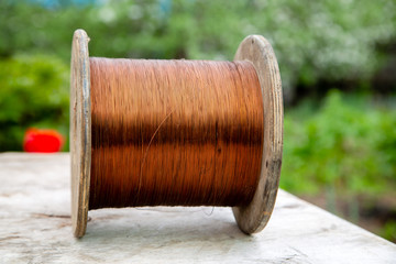 wooden cable reel with wound copper wire
