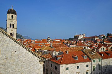 Fototapeta premium Exterior architecture and design of Dubrovnik old town city walls and landscape with clear blue sky, southern Croatia fronting the Adriatic sea encircled with massive stone