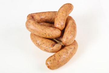 Tasty meat sausages over white background