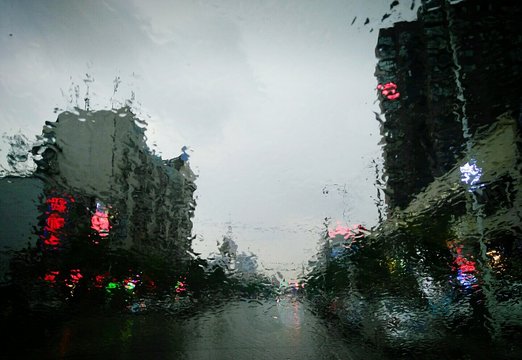 View Of Urban Road Through Windsheild