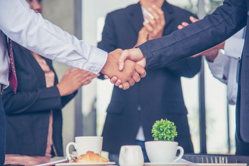 Team Business Partners shaking hands together to Greeting Start up new project. Shakehand Teamwork...
