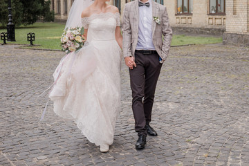 Fototapeta na wymiar bride and groom in summer park together