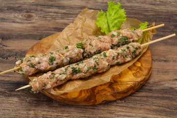 Raw minced pork skewer kebab for grill