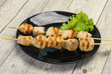 Grilled pork skewer served salad