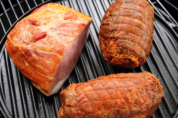 two roasts and a delicious prague ham on the grill