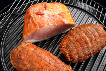 two roasts and a delicious prague ham on the grill