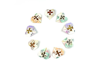 Czech money folded in heart shape isolated on white background in circle