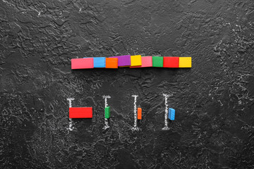 Composition with blocks on dark background. Concept of social distance