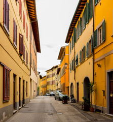 Fototapeta na wymiar Old buildings on a narrow street in the historical center of San Miniato