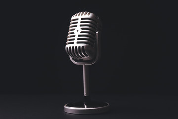 Retro microphone on dark background