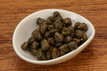 Tasty capers in the bowl