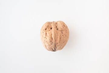 Walnuts on a white background close-up. The concept of vegan and vegetarian. Getting Vitamins from Nuts