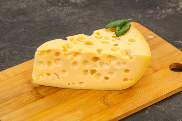 Maasdam cheese - yellow triangle with holes
