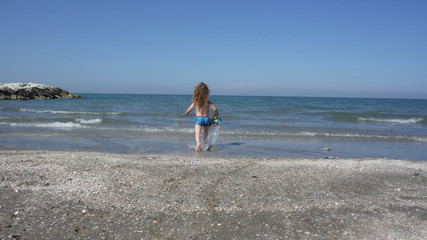 Kid playing on the beach