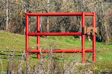 Fototapeta na wymiar Bright red antique structure for animal care works