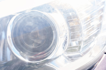 Old scratched car headlight. abstract background,cold tinting