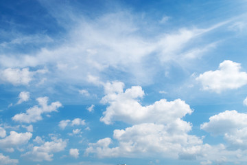 Natural sunny blue sky background with beautiful puffy white cumulus clouds & fluffy cirrus...