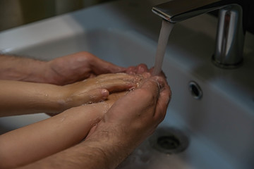 washing hands with soap.  Washing a child’s hands with soap and water to prevent coronavirus and hygiene to stop the spread of coronavirus. wash your hands with soap and hot water